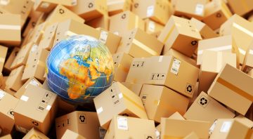 Background with heap of cardboard boxes, parcels and Earth globe